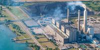 Ambiguous Pledges Leave Large Uncertainty under Paris Climate Agreement